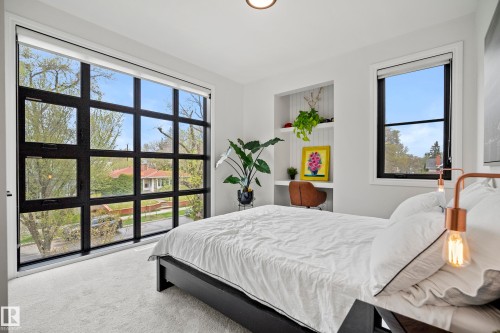Expansive grid-pane window with black framing - 6115 111 Avenue, Edmonton, AB - Indoor Photo Showing Bedroom