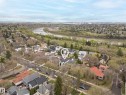 Aerial perspective showcasing a residential neighborhood with mature trees - 6115 111 Avenue, Edmonton, AB  - Outdoor With View 