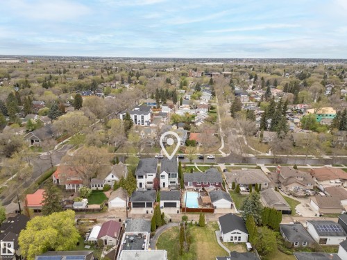 Aerial perspective showcasing a residential neighborhood characterized by mature trees and varied architectural styles - 6115 111 Avenue, Edmonton, AB - Outdoor With View