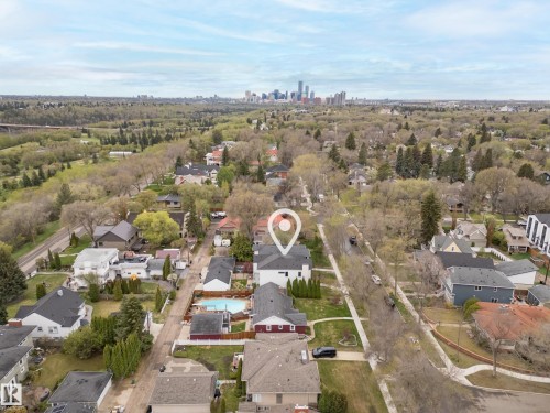 Aerial perspective showcasing a residential area with varied housing styles - 6115 111 Avenue, Edmonton, AB - Outdoor With View