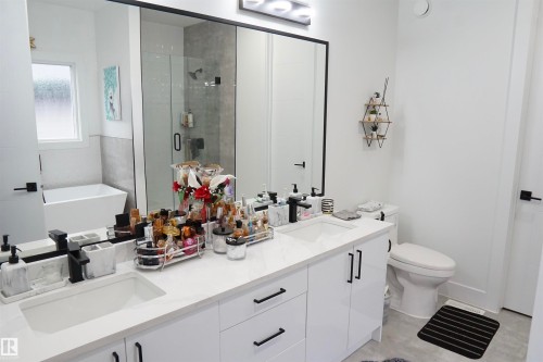 Dual vanity with integrated sinks and white countertops - 17703 74 Street, Edmonton, AB 