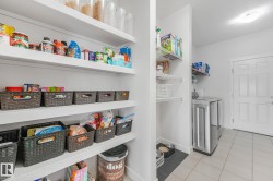 Built-in pantry shelving provides extensive storage capabilities - 