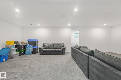 Spacious room featuring light gray carpet, recessed lighting, and white walls - 556 Merlin Landing Landing, Edmonton, AB 