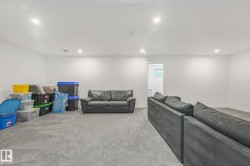 Spacious room featuring light gray carpet, recessed lighting, and white walls - 