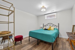 Interior room featuring wood-finish flooring and light-toned walls - 