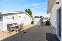 Expansive concrete patio area offering outdoor living space - 