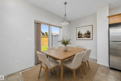 Dining area with direct patio access - 101 13825 155 Avenue, Edmonton, AB 
