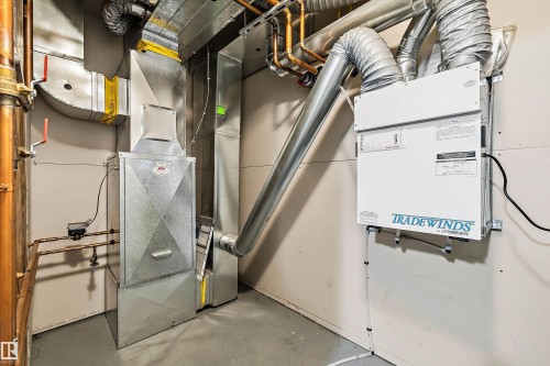 HVAC system with extensive ductwork, a forced-air furnace, copper piping, and a "Tradewinds by Lifebreath" air exchanger - 101 13825 155 Avenue, Edmonton, AB 