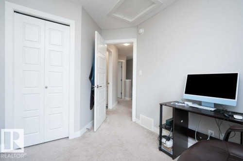 Light gray painted walls complementing neutral carpet flooring - 96 1530 Tamarack Boulevard, Edmonton, AB 