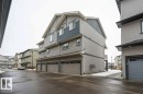 Three-story multi-unit structure featuring horizontal siding and dark trim accents - 96 1530 Tamarack Boulevard, Edmonton, AB 
