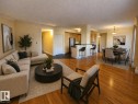 Open-concept living and dining area featuring warm wood-finish flooring - 603 9707 105 Street, Edmonton, AB  - Indoor Photo Showing Living Room 