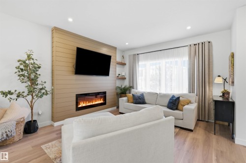 73 Wiltree Terrace, Fort Saskatchewan, AB - Indoor Photo Showing Living Room With Fireplace