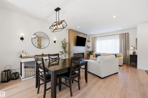 73 Wiltree Terrace, Fort Saskatchewan, AB - Indoor Photo Showing Dining Room With Fireplace