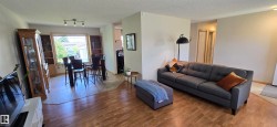 Bright interior with wood-finish flooring throughout the main living areas - 