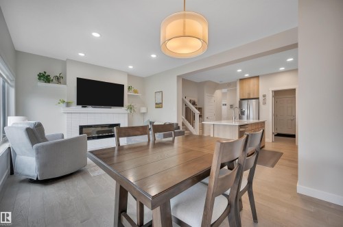 20709 99A Avenue, Edmonton, AB - Indoor Photo Showing Dining Room With Fireplace