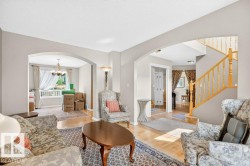 Open-concept living area with light wood-finish flooring - 