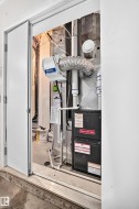 Utility closet housing a Goodman furnace and a whole-house humidifier - 