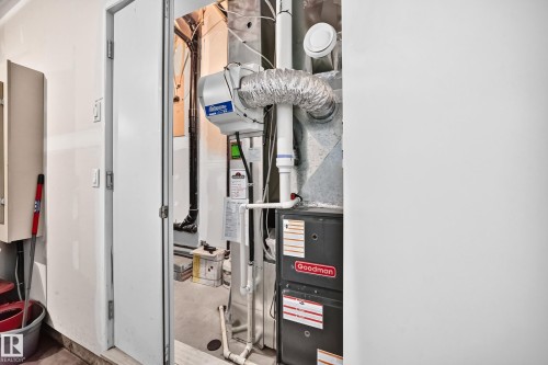 Utility room featuring a Goodman furnace and a whole-house humidifier - 37 13003 132 Avenue Nw, Edmonton, AB 