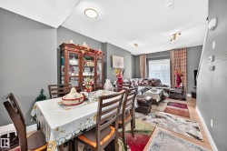 Open-concept living space with light wood-finish flooring - 