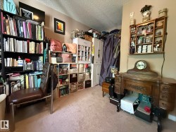 Carpeted interior space featuring neutral wall paint - 
