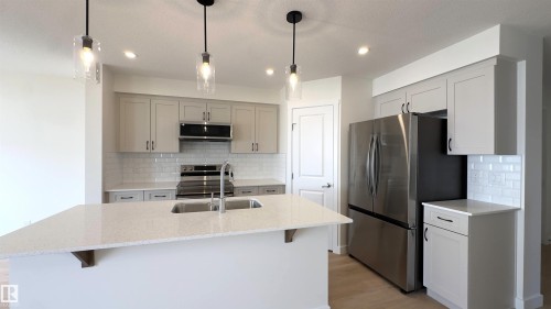 115 Ficus Way, Fort Saskatchewan, AB - Indoor Photo Showing Kitchen With Upgraded Kitchen