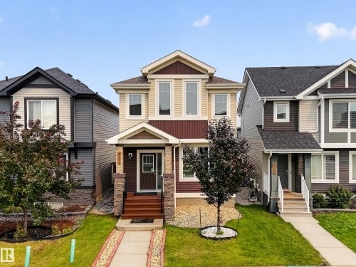 Contemporary two-story residence featuring a multi-textured facade with vertical and horizontal siding - 2331 Casey Crescent Sw, Edmonton, AB 