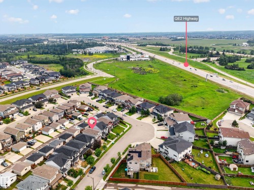 Aerial perspective showcasing a residential development with varied housing styles - 2331 Casey Crescent Sw, Edmonton, AB 