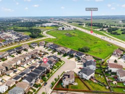 Aerial perspective showcasing a residential development with varied housing styles - 