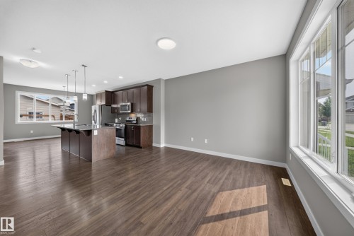 Open concept living area featuring wood-finish flooring - 2331 Casey Crescent Sw, Edmonton, AB 