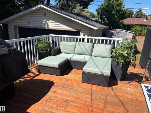 Expansive wood deck with white railing - 15922 92 Avenue, Edmonton, AB 