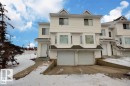 White siding exterior with multiple bay windows and a dual-car garage - 9457 156 Street, Edmonton, AB 