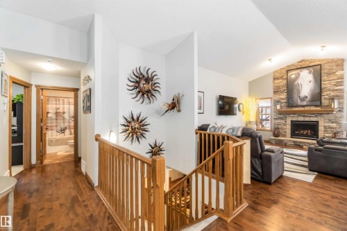 The property features rich hardwood flooring throughout - 61 Linkside Blvd, Spruce Grove, AB 