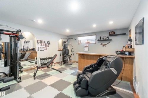 This versatile space features a checkerboard patterned floor, recessed lighting, and a window providing natural light - 61 Linkside Blvd, Spruce Grove, AB 