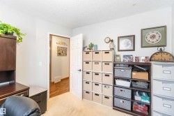 This room features light-colored walls and carpeted flooring, providing a neutral palette - 