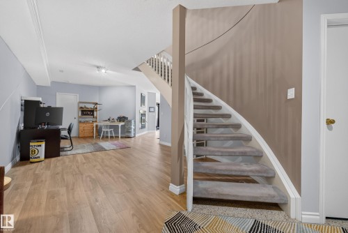 curving staircase to walkout level - 17 High Ridge Crescent, Sherwood Park, AB 