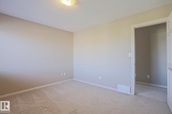 Neutral-toned wall paint and textured ceiling - 