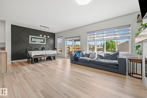 Open-concept main living area with wide plank wood-finish flooring - 1931 Westerra Lane, Stony Plain, AB 