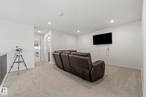 Carpeted bonus room with recessed lighting and a wall-mounted television - 1931 Westerra Lane, Stony Plain, AB 