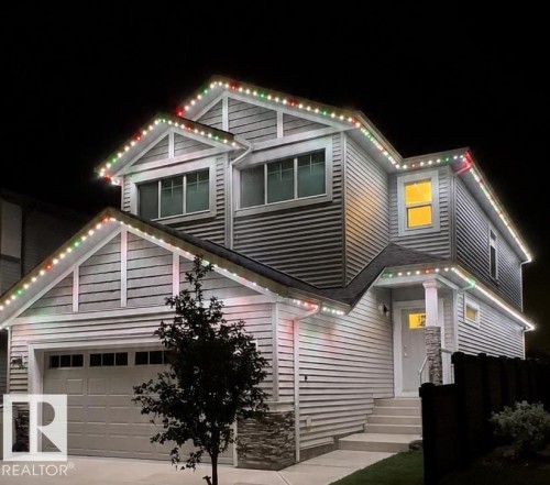 Modern two-story residence featuring horizontal siding and stone accents - 1931 Westerra Lane, Stony Plain, AB 