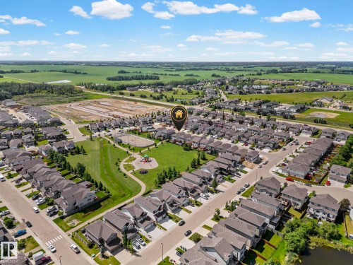 Aerial perspective showcasing a residential neighborhood with varied housing styles - 1931 Westerra Lane, Stony Plain, AB 