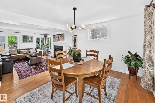 Open-concept dining area featuring hardwood flooring - 10323 138 Street, Edmonton, AB 