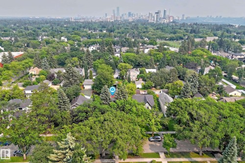 Aerial perspective showcasing a residential neighborhood with a dense tree canopy - 10323 138 Street, Edmonton, AB 
