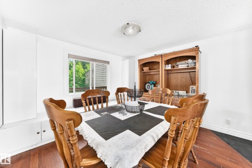 Wood-finish flooring throughout, complemented by white walls and a white ceiling with a flush-mount light fixture - 191 Ridgewood Terrace, St. Albert, AB 