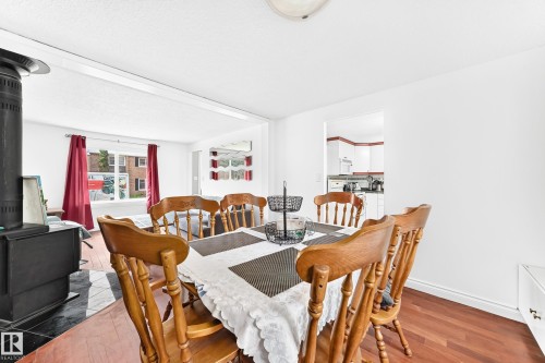 Dining area featuring wood-finish flooring, white walls, and an overhead light fixture - 191 Ridgewood Terrace, St. Albert, AB 
