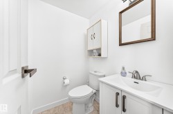 White vanity with integrated sink and brushed nickel faucet - 