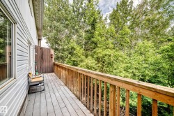 Spacious outdoor deck with wood-finish flooring and railing - 