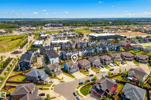 Residential neighborhood featuring a mix of detached homes and townhomes, surrounded by established landscaping and paved roadways - 70 James Crescent, St. Albert, AB 