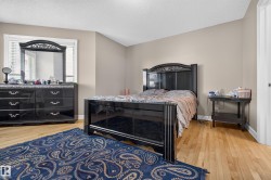 Light wood-finish flooring complements neutral wall tones - 