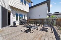 Expansive wooden deck featuring horizontal planking and a wooden perimeter railing - 