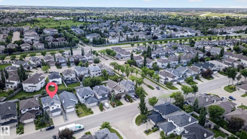 Aerial perspective showcasing a residential neighborhood with numerous detached homes - 547 Leger Way, Edmonton, AB 